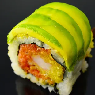 a sushi roll with avocado