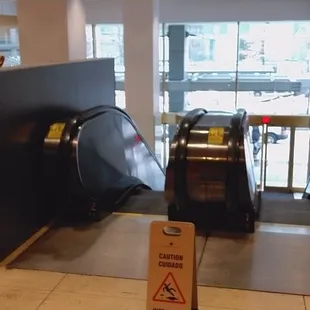 Escalators from entrance to upper level where restaurant is