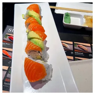 a sushi roll with avocado and salmon