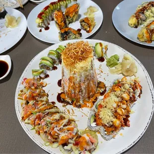 a variety of sushi dishes on a table