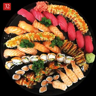 a platter of sushi on a black plate