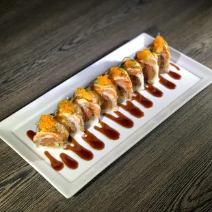 Rising Sun Roll : spicy tuna, cucumber, seared salmon torched with spicy mayo, eel sauce