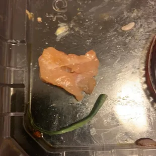 My daughter got to the bottom of her Teriyaki Solo bowl and found this piece of raw chicken. Be careful when eating the teriyaki solo!