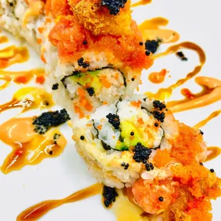 a piece of sushi on a white plate