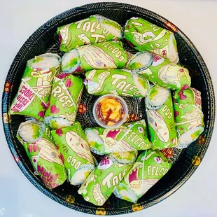 a bowl of sushi rolls