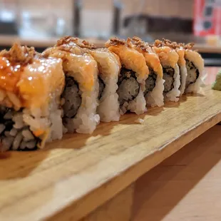 a sushi on a wooden board