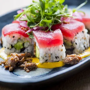 a closeup of a plate of sushi