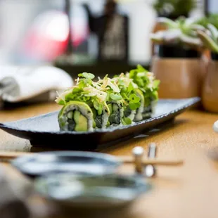 a plate of sushi on a table