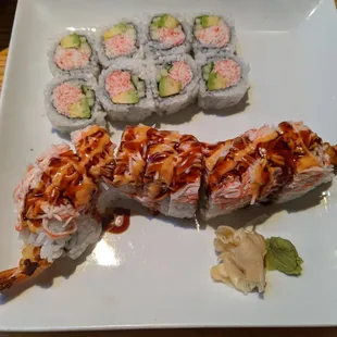 a plate of sushi and a roll
