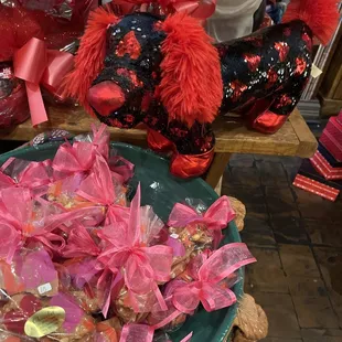 a bowl of candy and a teddy bear