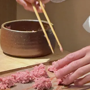 Nakaochi tuna meat scraped off the ribs is mixed w negi and portioned into individual balls.