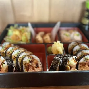 a close up of a tray of sushi