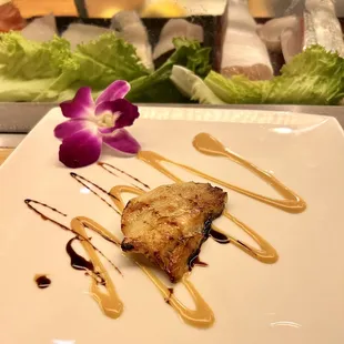Grilled hamachi cheek.