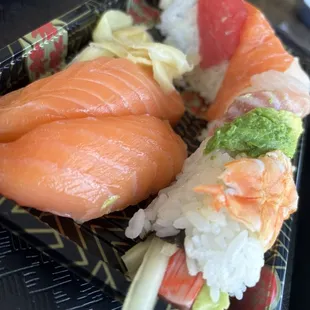 Salmon nigiri left and rainbow roll right