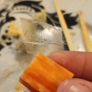 The plastic was left on the crab meat in my rainbow roll. Smh