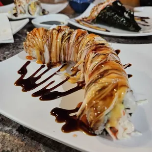 a sushi roll on a white plate