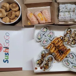 Top Left to Right: Cream Puff, Seared Salmon Nigiri and Avocado Roll Bottom: KK Combo (Shrimp Temura, Lion King and California Roll)