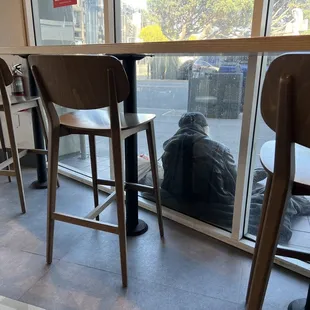 Homeless person you have to step over to walk in the restaurant.