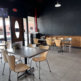 Clean inside. Few tables and chairs.