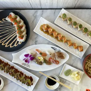OMG Roll, Salmon Lemon Roll, Yellowtail Jalapeno Roll, Fire Roll, Tempura Udon and assorted nigiri