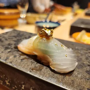 Madai with shiso, ume, and gold leaf