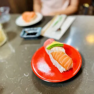 a plate of sushi on a table