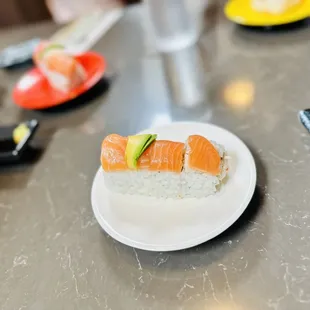 a plate of sushi on a table