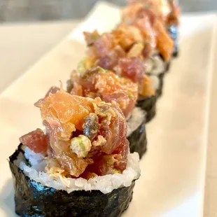 a close up of a plate of sushi