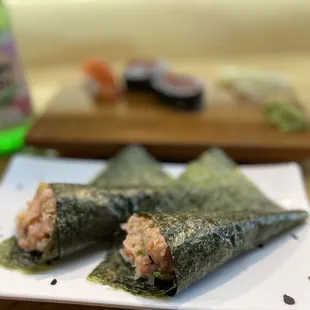 two pieces of sushi on a plate