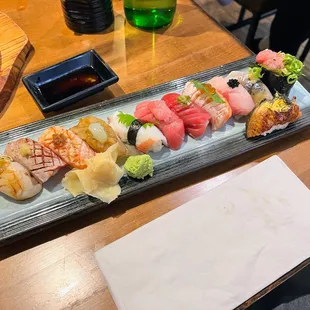 a long rectangular platter of sushi