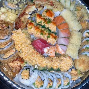 a large platter of sushi