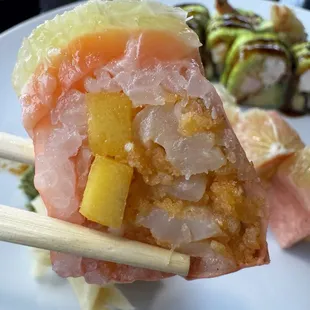 Inside the Sweetheart roll- spicy scallop and mango topped with salmon and lemon wrapped in soy paper