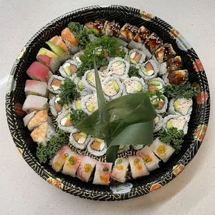 a platter of sushi rolls