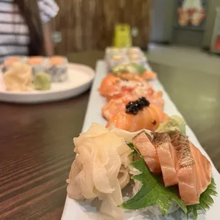 a long plate of sushi