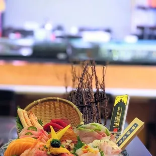 a bowl of sushi on a table