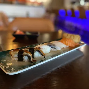 a plate of sushi on a table
