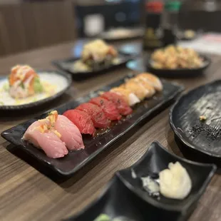 Nigiri - yuzu yellowtail, garlic tuna, super white tuna