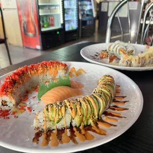 two plates of sushi on a table