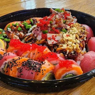 a bowl of sushi on a table