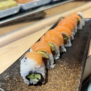 Salmon Lover s Roll (08/26/2023) they didn't cover the whole roll, the front and end are only half salmons