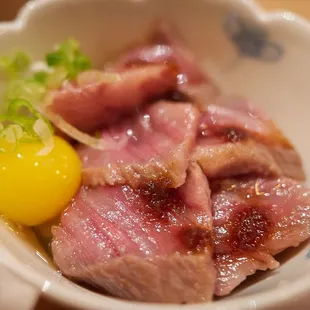 "Wagyu LocoMoco" - Torched Miyazaki A5, cured quail egg yolk, spring onion on shitake mushroom rice