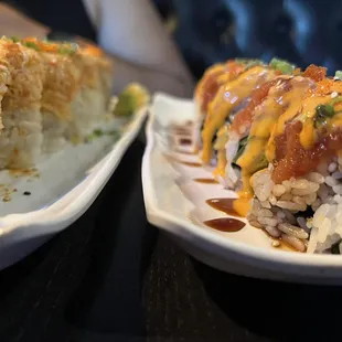 two plates of sushi on a table