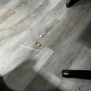 Trash/debris/crumbs/litter on floor and benches