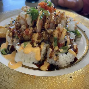 Volcano (seafood sautéed in garlic on top and shrimp, avocado and cream cheese inside) has crawfish!