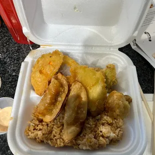 a styrofoam container of food