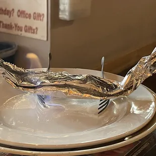 a piece of tin foil on a plate
