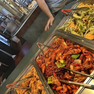 a man standing in front of a buffet