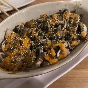 a dish of food with mushrooms and mushrooms