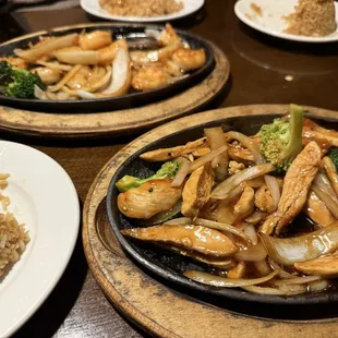 Chicken sizzling plate and shrimp sizzling plate with fried rice.