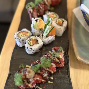 a plate of sushi and a bowl of soup